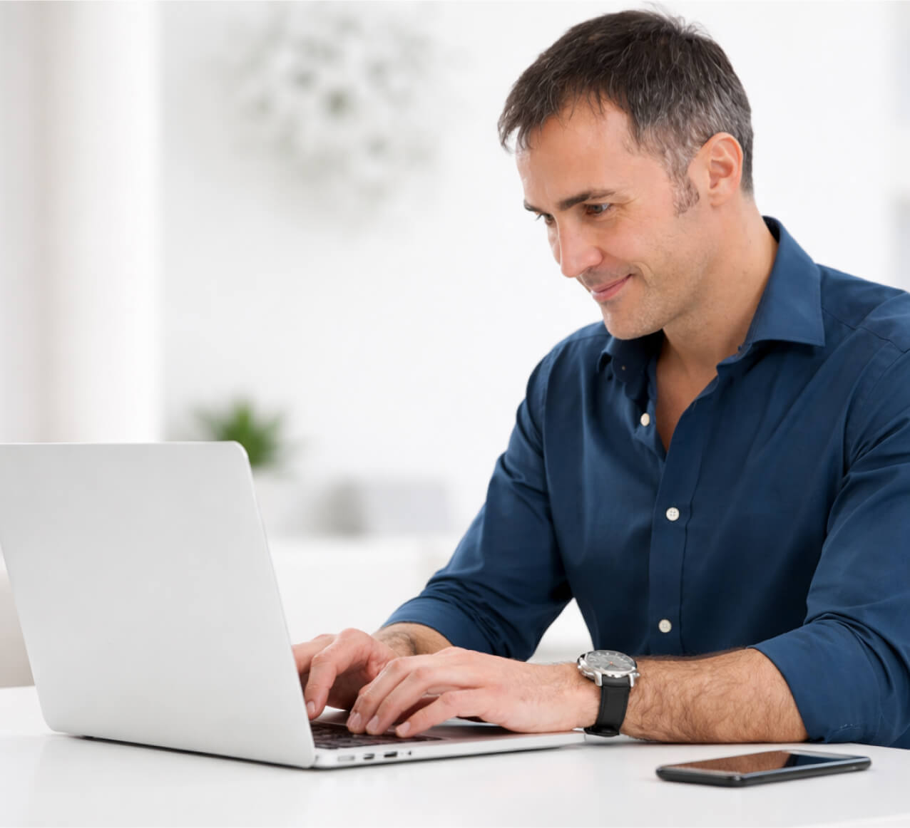Woman in yellow dress using laptop