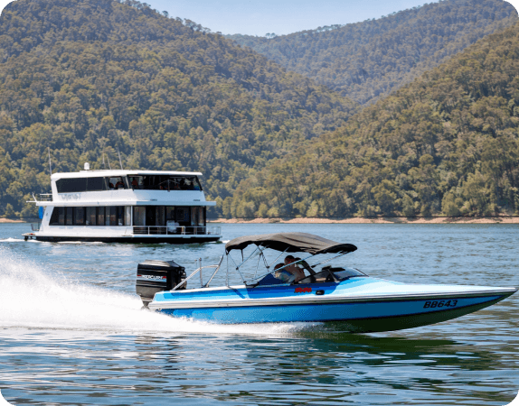 Speedboat on Lake Eildon near Mansfield with forested hills in the background